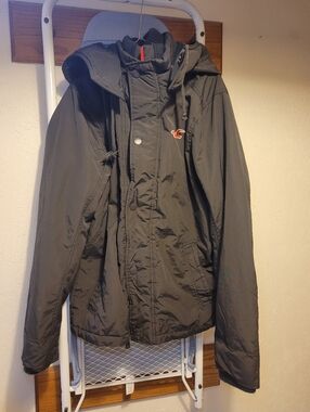 Hollister Men's Dark Gray Hooded Raincoat with Orange Logo